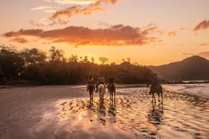 Guanacaste Horse riding at sunset on Playa Conchal beach