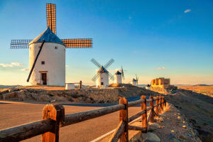 Toledo Spanish windmills and medieval castle on a hill in Consuegra, Toledo, Spain.